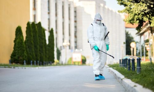 man-protective-suit-disinfecting-city-streets-coronavirus-pandemic_637285-7908